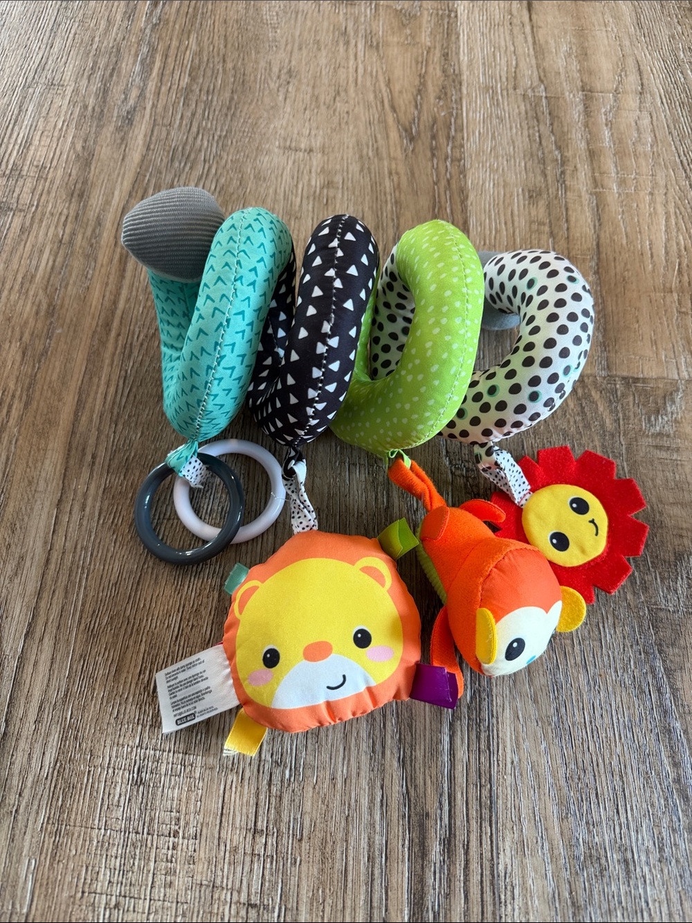 Infantino Spiral Stroller Toy with Orange Lion, Red Sun & Green Rings